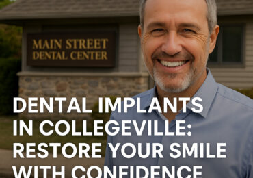 Smiling man standing outside Main Street Dental Center in Collegeville, PA, representing restored confidence after dental implant treatment.