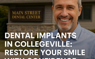 Smiling man standing outside Main Street Dental Center in Collegeville, PA, representing restored confidence after dental implant treatment.