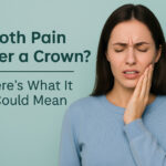 Worried adult touching jaw due to tooth pain under a dental crown in a modern dental office at Main Street Dental Center in Collegeville, Pennsylvania.