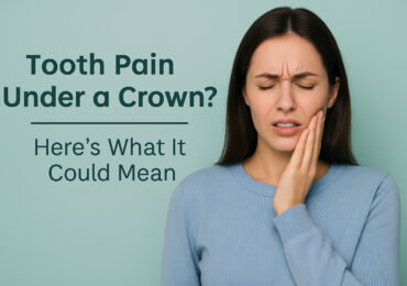 Worried adult touching jaw due to tooth pain under a dental crown in a modern dental office at Main Street Dental Center in Collegeville, Pennsylvania.