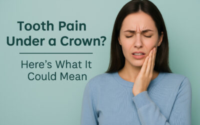 Worried adult touching jaw due to tooth pain under a dental crown in a modern dental office at Main Street Dental Center in Collegeville, Pennsylvania.
