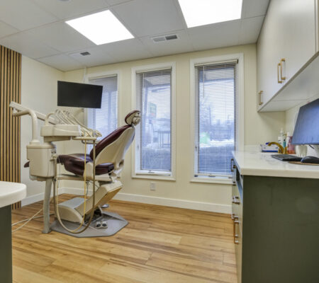 Modern dental treatment room at Main Street Dental Center with advanced equipment and comfortable patient chair